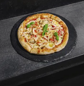Food, A delicious pizza sits on a black slate board