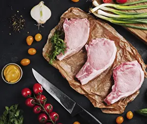 Food, Several raw pork steaks on baking paper