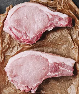 Food, Several raw pork steaks on baking paper