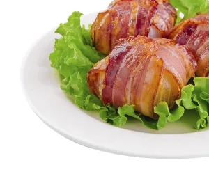 food still-life, Twisted rolls with bacon on white plate