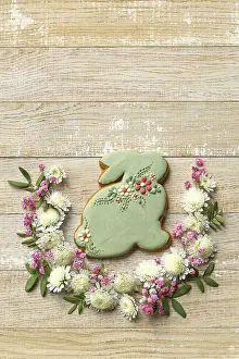 Food, Wooden background with easter bunny cookies and flowers
