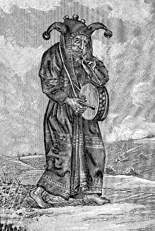 The Fool, with drum and flute, long coat with bell-trimmed hood