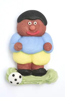 Football player made of icing, used as a decoration for pastries and sweets