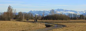 Footpath in Wetzikon and snow covered mountain range