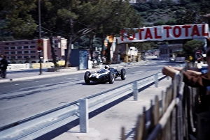 Formula One race at the 1961 Monaco Grand Prix, Jack Brabham in the Cooper Climax racing car, passing the pits