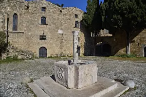 Fountain, Agyrokastrou, Former castle courtyard with fountain and central Tor tor