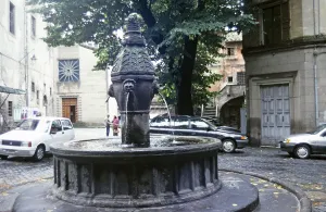 Fountain in city centre street with water by Roman aqueduct, Viterbo, Lazio region, Italy 1998