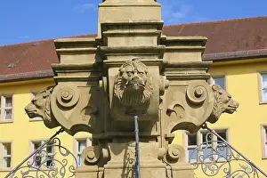 Fountain with lion heads, stone figures