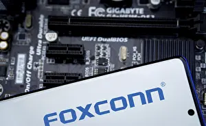 Category Historic EN Prints: Foxconn company Logo on Smartphone