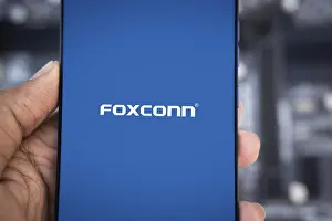 Category Historic EN Prints: Foxconn company Logo on Smartphone