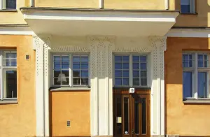 Fragment of the facade and the design of the entrance to the building in the style of national romanticism in Helsinki