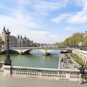 France, April 06 2019: Cityscape of Paris and Saint-Michel bridge across Seine river
