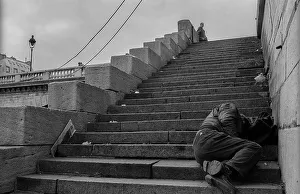 France, Paris, 24.03.1990, man on the steps of the Pont de Arcole
