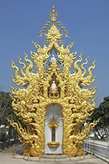 A free-standing chapel with statues of Buddha