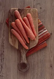Fresh carrots on a chopping board