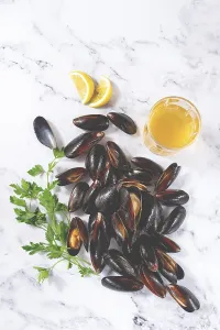 Fresh mussels scattered on the table