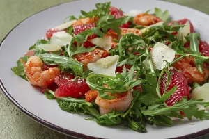 Fresh shrimp salad with arugula