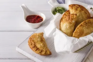 Fried chebureks, close-up, on a white background