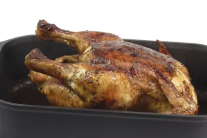 Fried chicken in a baking tin Fried chicken in a pan ready to eat