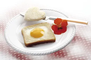 Fried egg on toast, heart shaped, nasturtium