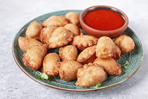 Fried mini chebureks, with sauce