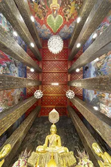 Frog's-eye view: coffered ceiling and golden Buddha statue