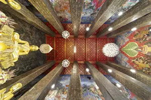 Frog's-eye view: coffered ceiling and golden Buddha statue