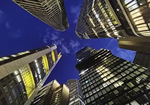 Frog's-eye view of skyscrapers in the banking district in the evening