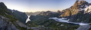 Frozen lake Trolljordvatnet, mountains and snow in evening mood