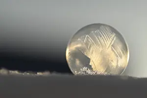 Frozen soap bubble in the snow, Herten, Germany