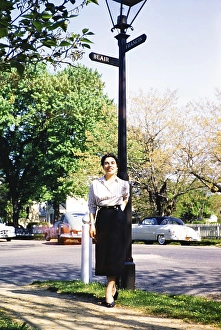 Full-length portrait of elegantly dressed woman outdoors Location, Williamsburg, Virginia, USA USA c 1953 NB) Image error Damage