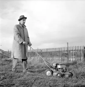 Garden equipment of the 1950s. A motor driven lawn mover