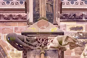 Two gargoyles, one of them the famous Hinternentbloesser