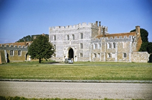 Gatehouse of St Osyth's Abbey, Essex, England, United Kingdom 1956 Triumph Mayflower car parked outside