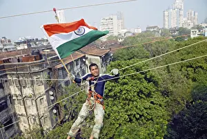 Category Historic EN Prints: Gaurav sharma crossing between two buildings on rope