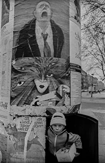 GDR, Berlin, 18. 03. 1989, child in an advertising pillar