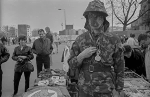 GDR, Berlin, 22.02.1990, salesman in NVA camouflage suit