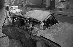 GDR, Berlin, 8.1.1990, children in a wrecked car in Steinstrasse