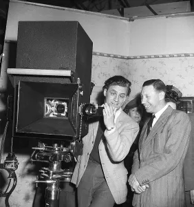 George Formby British singer, musician and actor (1904-1961), known as the Ukulele man. Here during a visit to Sweden on 14 May 1946. George Formby was the highest paid artist in England in 1940. Here with George Fant in the studio of Euorpa Films