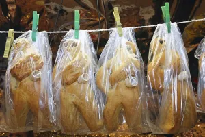German advent cakes wrapped in plastic hanging on the clothesline