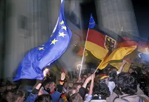 German flags, citizens of Berlin celebrating the reunion of East