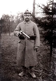 German soldier with carbine and spiked helmet at a photo shoot