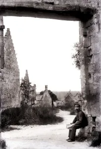 German soldier in front of a destroyed village