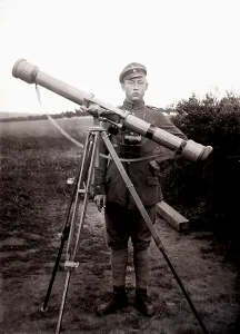 German soldier using a reflecting telescope to determine the firing trajectory
