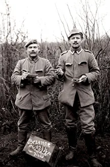 Two German soldiers taking a photo in a forest in the Vosges