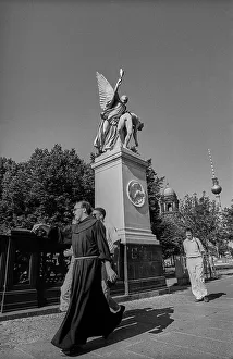 Germany, Berlin, 1 July 1991, Priest on the castle bridge