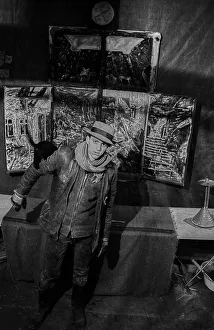 Germany, Berlin, 30.11.1991, young artist in front of his triptych