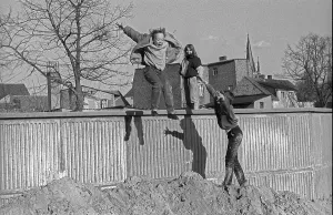 Germany, Werder, 23. 03. 1991, Children jumping off a wall