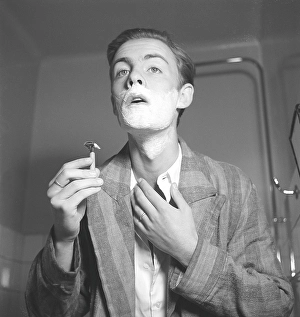 Getting a shave in the 1940s. A young man is shaving. Sweden 1940 Kristoffersson ref 157-5