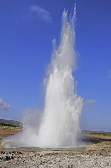 The geyser Strokkur fires steam and boiling water up to a height of around 20m